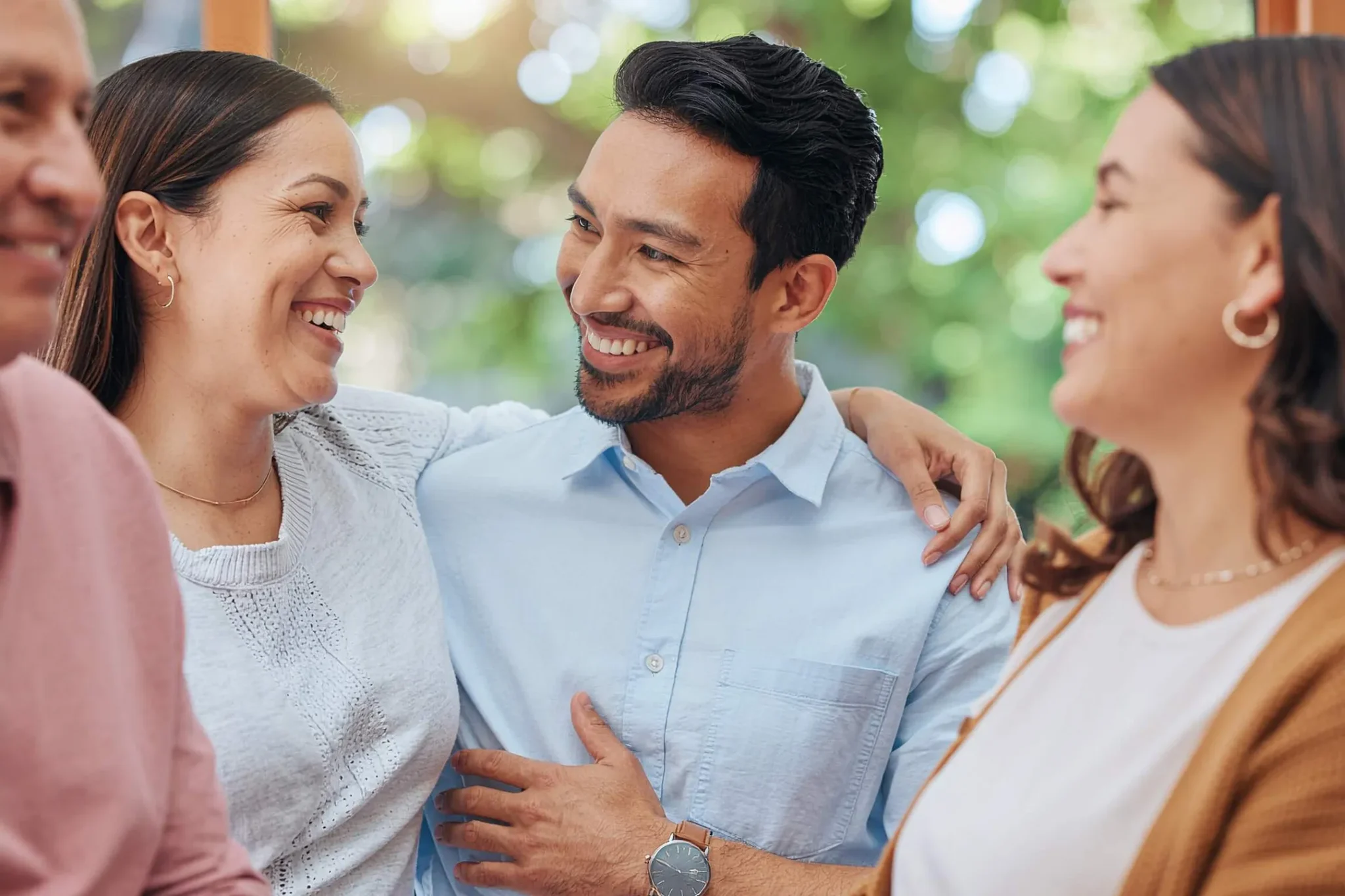 A young couple smiling and looking at one another